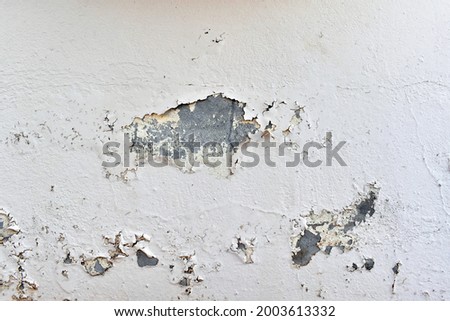 Peeling painted concrete wall. Leaking rain cause the wall and ceiling cracked.  Stok fotoğraf © 
