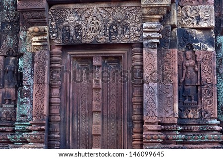 CAMBODIA - JANUARY 05: Ancient bas-relief at the facade of Banteay Srey Temple on January 05, 2013 in Angkor Area, Cambodia. Banteay Srey is a 10th century Cambodian temple dedicated to the God Shiva