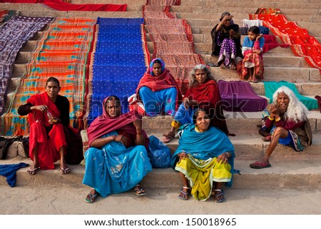 VARANASI - JANUARY 15: Unidentified hindu women dry their saris after bathing in the sacred Ganges river at Dashashwamedh ghat on January 15, 2010 in Varanasi, State of Uttar Pradesh, India