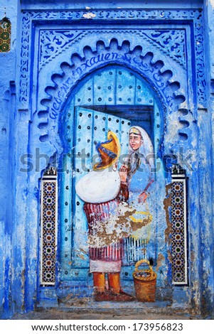 CHEFCHAOUEN, MOROCCO - JANUARY 02: Fresco painting wall at Uta El-Hammam square on January 02, 2014 in Chefchaouen, Morocco. This is the liveliest square in the Chefchaouen medina.