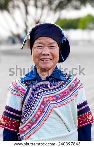 YUANYANG, YUNNAN, CHINA - MAY 05: An Unidentified Hani woman in natonal clothes poses for a photo during Yuanyang festival on May 05, 2014 in Yuanyang, China.