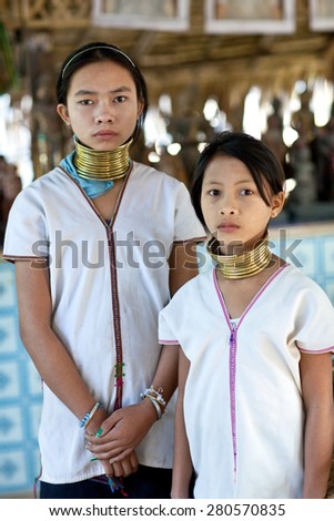 MYINKABA, MYANMAR - JANUARY 09: Padaung tribe girls poses for a photo on January 09, 2012 in Myinkaba Village, Bagan, Myanmar. Padaung tribe women are minority of Myanmar exploited for tourism reasons