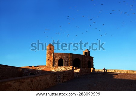 Essaouira Fortress, Morocco. Essaouira is a city in the western Moroccan economic region of Marrakech Tensift Al Haouz, on the Atlantic coast. It has also been known by its Portuguese name of Mogador.