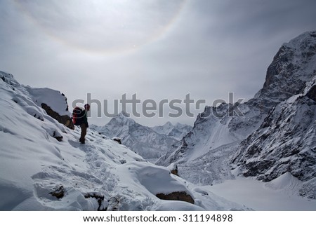 SAGARMATHA, NEPAL - MARCH 15: Tourist resting on the road to Everest Base Camp on March 15, 2010 in Sagarmatha National Park, Nepal Himalaya