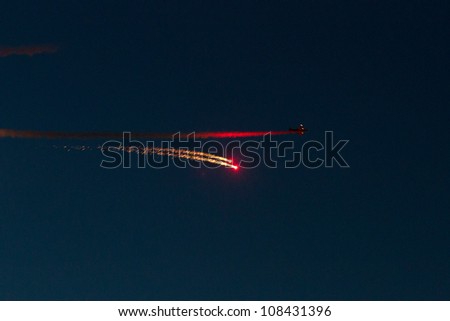 BUCHAREST - JULY 21: Evening Air Performance by Romanian Air-club at Bucharest International Air Show & General Aviation Exhibition (BIAS 2012) on July 21, 2012 in Bucharest, Romania