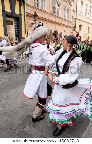 PRAGUE - AUGUST 26: Unknown people dance in traditional Russian costumes at Folklore Festival Prague Fair, 25-30.8.2009, close to the Old Town Square on August 26, 2009 in Prague, Czech Republic