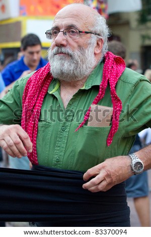 BARCELONA - AUGUST 21: Member of the Human Towers (Colles Castelleres) preparing for the representation in the Gracia Festival (La Festa Major de Gracia) on August 21, 2011 in Barcelona, Spain