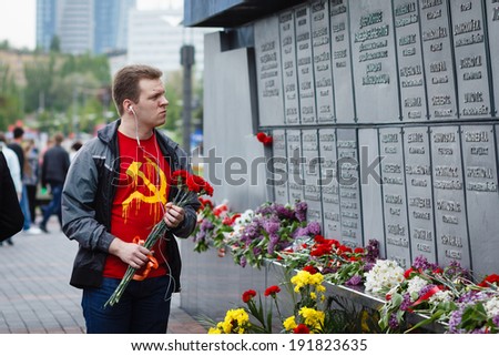 DONETSK, UKRAINE - MAY 9: Man in shirt with soviet symbols, during celebration of the Victory Day near \