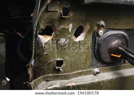 DONETSK, UKRAINE - JUNE 01: Holes from large-caliber bullets in the Kamaz with wounded hit by an Ukrainian army, at the Russian Orthodox Army\'s block post on june 01, 2014 in Donetsk.