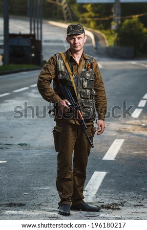 DONETSK, UKRAINE - JUNE 01: One of the fighters at the Russian Orthodox Army's block post on the road to the airport on june 01, 2014 in Donetsk.