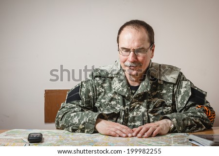 DONETSK, UKRAINE - JUNE 21: Portrait of Deputy Commander of the militia Fedor Berezin in the Donetsk Regional State Administration on background on june 21, 2014 in Donetsk.