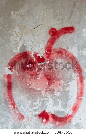 Weathered damaged wall with painted apple