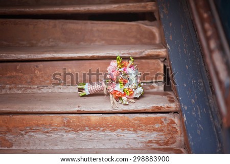 Bridal bouquet on wood stairs