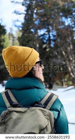 Similar – Image, Stock Photo unrecognizable woman wearing yellow raincoat preparing hammock to relax. Camping outdoors. autumn season