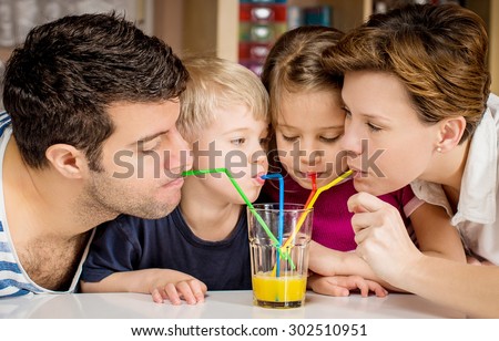 Healthy family drinking fresh orange juice