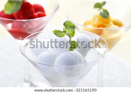 Colorful Mix fruit sorbet in cocktail glass.