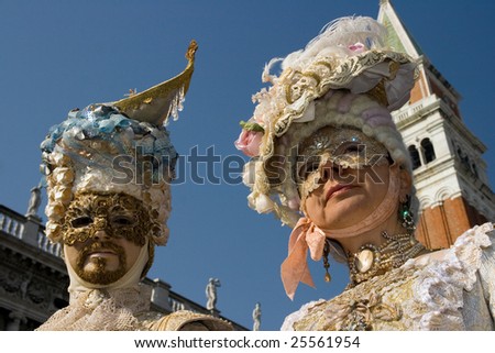 VENICE, FEBRUARY 21, 2009: Masks from the Venice carnival 2009 captured at St Mark's Square with St Mark's Campanile in the background. The Venice carnival 2009 lasted from February 13 -24, 2009.
