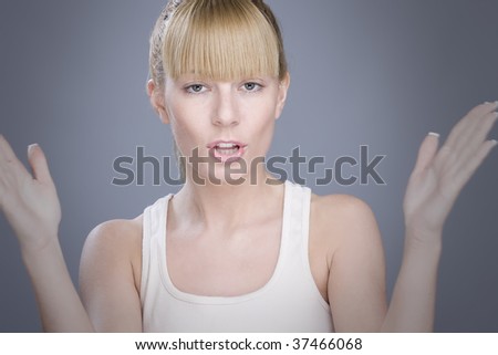 Young blond woman in white t-shirt showing off her hands