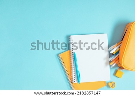 Image, Stock Photo blue notebook and scattered wooden multi-colored letters on an abstract background