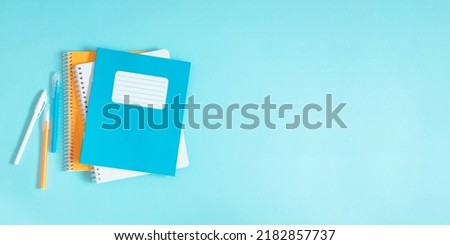 Similar – Image, Stock Photo blue notebook and scattered wooden multi-colored letters on an abstract background