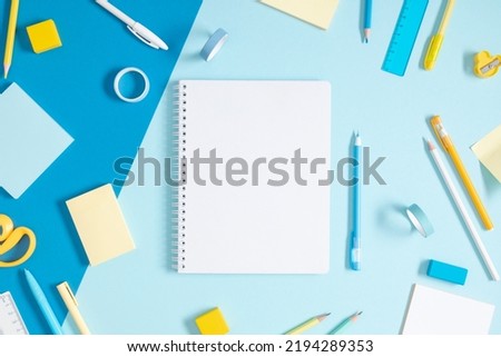 Similar – Image, Stock Photo blue notebook and scattered wooden multi-colored letters on an abstract background