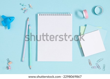 Similar – Image, Stock Photo blue notebook and scattered wooden multi-colored letters on an abstract background