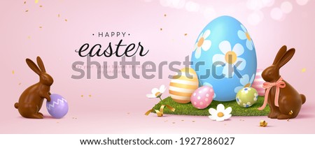 3d Easter banner with chocolate rabbits and beautiful painted eggs set on grass. Concept of Easter egg hunt or egg decorating art.