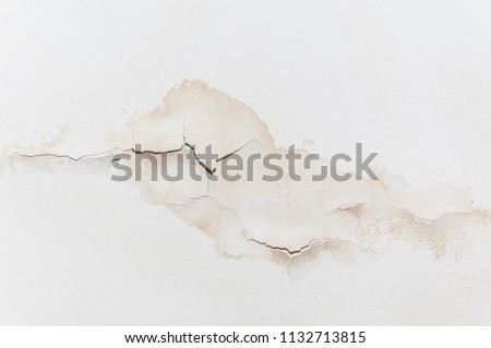 Big wet spots and cracks on the ceiling of the domestic house room after heavy rain and lot of water Stok fotoğraf © 