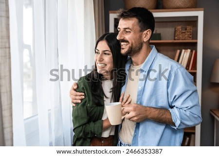 Similar – Image, Stock Photo Happy newlywed couple standing against waving sea