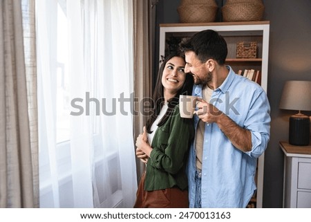 Similar – Image, Stock Photo Happy newlywed couple standing against waving sea