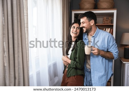 Similar – Image, Stock Photo Happy newlywed couple standing against waving sea