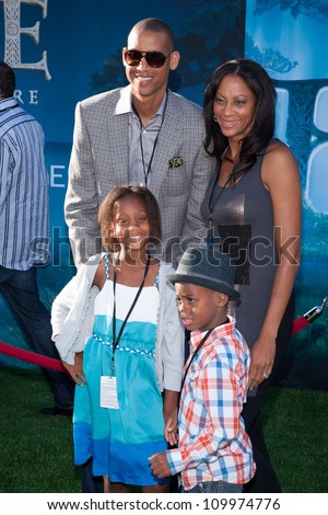 HOLLYWOOD, CA - JUNE 18: Basketball great, Reggie Miller and family arrive at the Los Angeles Film Festival premiere of \'Brave\' at Dolby Theatre on June 18, 2012 in Hollywood, California.