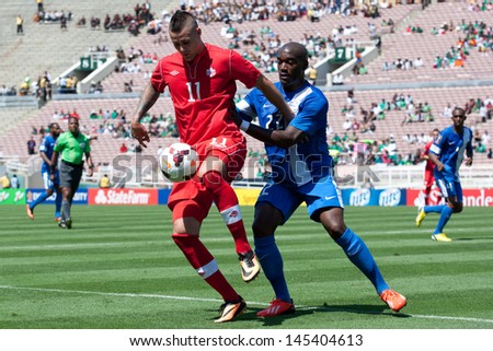 PASADENA, CA - JULY 7: Jean Sylvain Babin #22 of Martinique & Marcus Haber #11 of Canada during the 2013 CONCACAF Gold Cup game between Canada & Martinique on July 7, 2013 at the Rose Bowl.