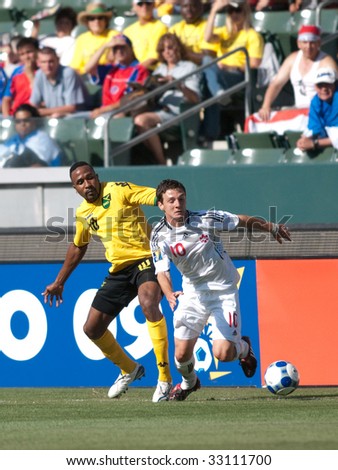CARSON, CA. - JULY 3: Concacaf Gold Cup soccer match, Canada vs. Jamaica at the Home Depot center in Carson. Ricardo Fuller and William Johnson fighting for the ball on July 3, 2009.