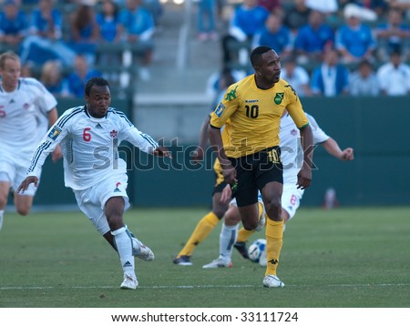 CARSON, CA. - JULY 3: Concacaf Gold Cup soccer match, Canada vs. Jamaica at the Home Depot center in Carson. Julian de Guzman and Ricardo Fuller move for position on July 3, 2009.