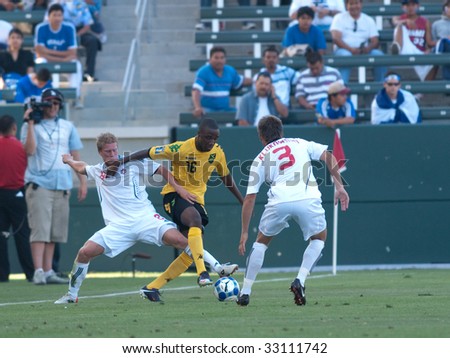 CARSON, CA. - JULY 3: Concacaf Gold Cup soccer match, Canada vs. Jamaica at the Home Depot center in Carson. Michael Klukowski and Marcel de Jong try to defend against Jermaine Johnson on July 3, 2009.