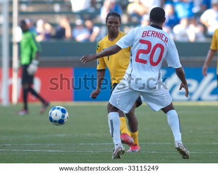CARSON, CA. - JULY 3: Concacaf Gold Cup soccer match, Canada vs. Jamaica at the Home Depot center in Carson. Patrice Bernier attacks as  Jason Morrison defends on July 3, 2009.