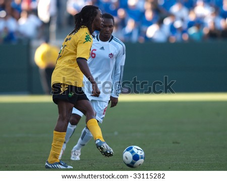 CARSON, CA. - JULY 3: Concacaf Gold Cup soccer match, Canada vs. Jamaica at the Home Depot center in Carson. Ricardo Gardner attacks with the ball while Julian de Guzman defends on July 3, 2009.