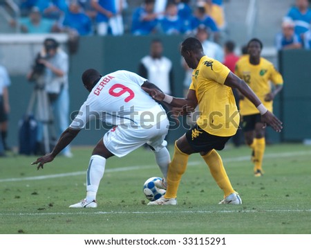CARSON, CA. - JULY 3: Concacaf Gold Cup soccer match, Canada vs. Jamaica at the Home Depot center in Carson. Claude Davis defending as Ali Gerba maneuvers around with the ball on July 3, 2009.