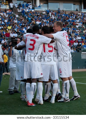 CARSON, CA. - JULY 3: Concacaf Gold Cup soccer match, Canada vs. Jamaica at the Home Depot center in Carson. Canadian team celebrates after Ali Gerba scored the winning goal in the 75th minute on July 3, 2009.