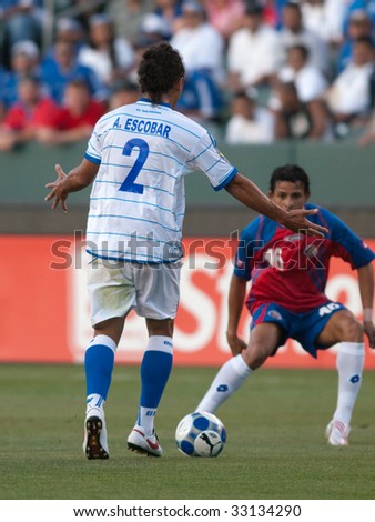 CARSON, CA. - JULY 3: Concacaf Gold Cup soccer match, Costa Rica vs. El Salvador at the Home Depot Center in Carson. Alexander Escobar trying to get past Esteban Sirias. July 3, 2009.