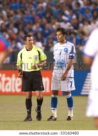 CARSON, CA. - JULY 3: Concacaf Gold Cup soccer match, Costa Rica vs. El Salvador at the Home Depot Center in Carson. Ramon Sanchez with the referee talking to him. July 3, 2009.