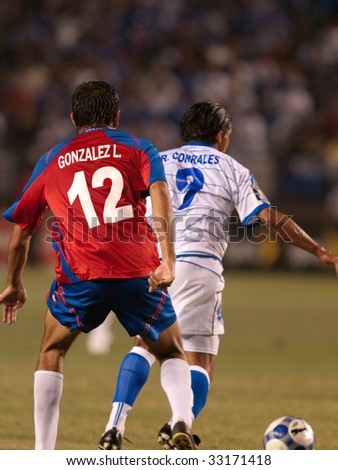 CARSON, CA. - JULY 3: Concacaf Gold Cup soccer match, Costa Rica vs. El Salvador at the Home Depot Center in Carson. Gonzalez chases down Corrales. July 3, 2009.