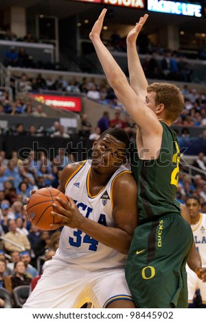 LOS ANGELES - MARCH 10: UCLA Bruins C Joshua Smith #34 & Oregon Ducks F E.J. Singler #25 during the NCAA Pac-10 Tournament basketball game on March 10 2011 at Staples Center.