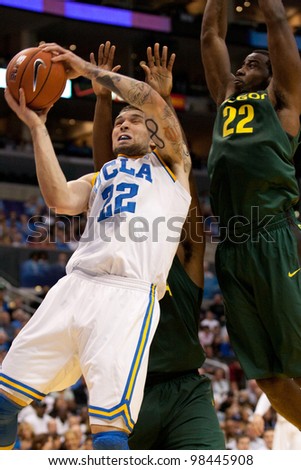 LOS ANGELES - MARCH 10: UCLA Bruins F Reeves Nelson #22 & Oregon Ducks G Teondre Williams #22 during the NCAA Pac-10 Tournament basketball game on March 10 2011 at Staples Center.