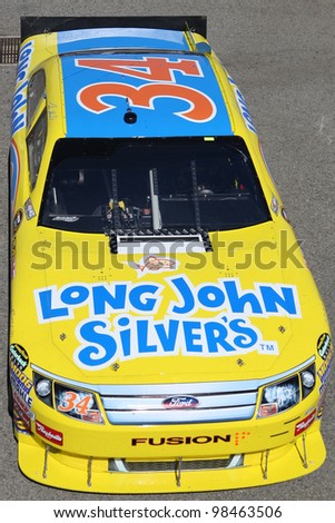 FONTANA, CA. - OCT 9: Sprint Cup Series driver Travis Kvapil in the Long John Silver\'s #34 car during the Pepsi Max 400 practice on Oct 9 2010 at the Auto Club Speedway.