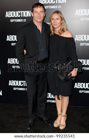 HOLLYWOOD - SEPT 15: Actor Jason Isaacs & wife arrive at the world premiere of 'Abduction' at Grauman's Chinese Theater on Sept 15 2011 in Hollywood.