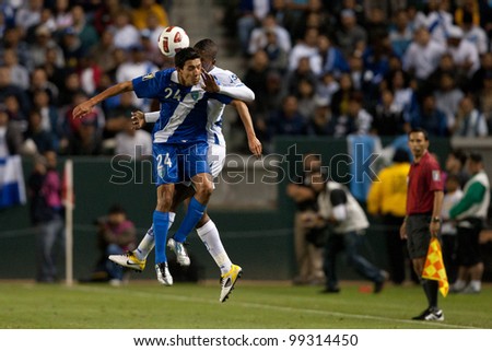 CARSON, CA. - JUNE 6: Guatemala player  M Jonathan Lopez #24 (front) & Honduras D Brayan Beckeles #24 (back) during the 2011 CONCACAF Gold Cup group B game on June 6 2011 at the Home Depot Center in Carson, CA.