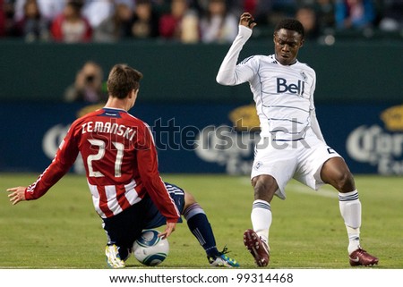 CARSON, CA. - JUNE 1: Chivas USA plauer M Ben Zemanski #21 (L) & Vancouver Whitecaps FC player M Gershon Koffie #28 (R) during the MLS game on June 1 2011 at the Home Depot Center in Carson, CA.