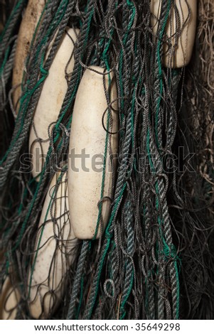 A bunch of fishing nets, with white floats.